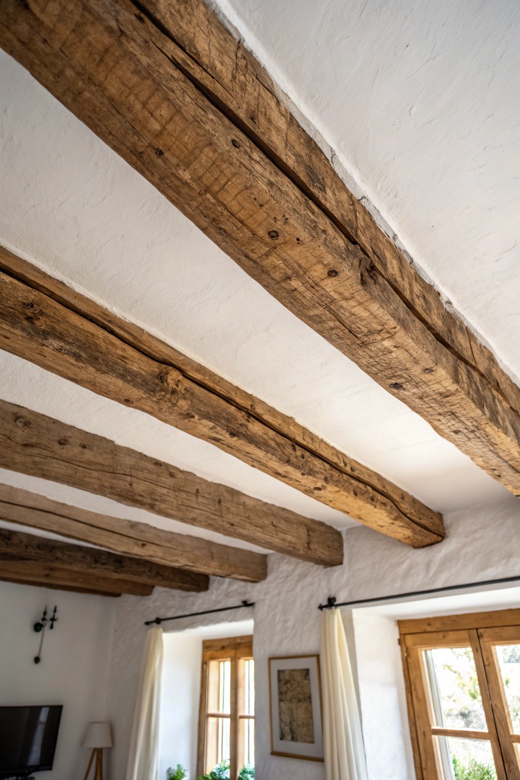 A single exposed wooden beam—pure, rustic elegance overhead.