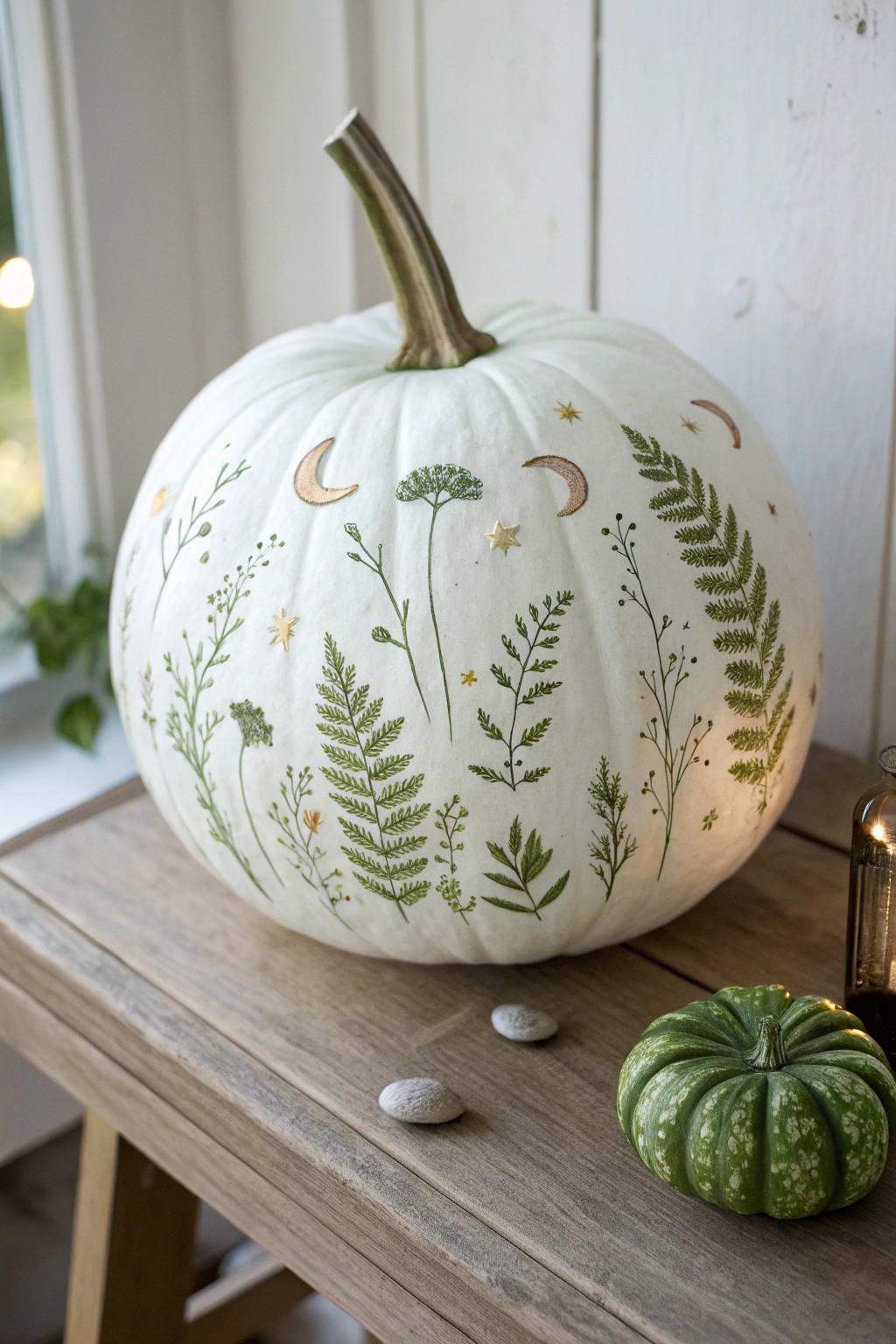 Scandinavian Glow: A minimal, hand-painted pumpkin that comes alive after dark.