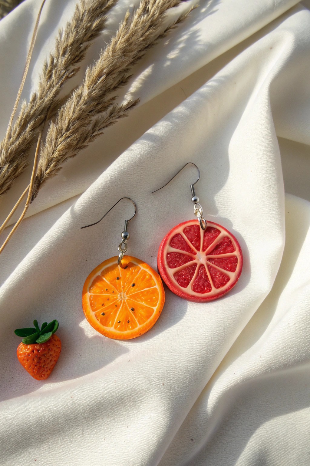 Bold fruit slice earrings: handmade charm with a pop of color for every sunny day.