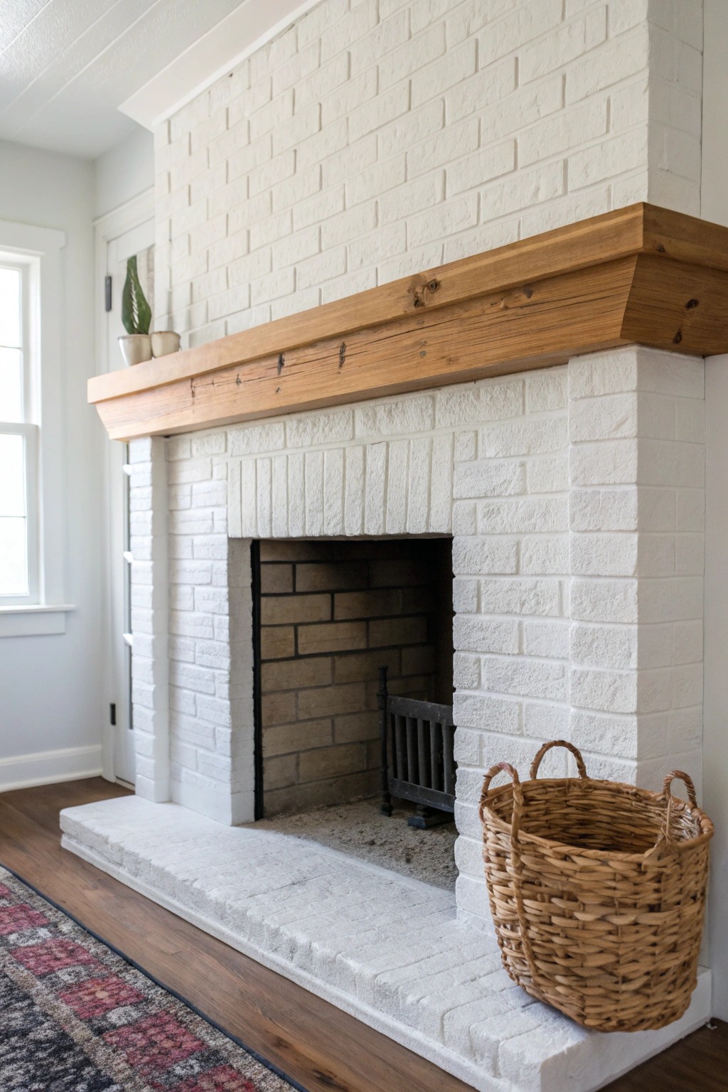 Elevate your fireplace with layered textures: painted brick, wood, and stone for timeless, natural charm.