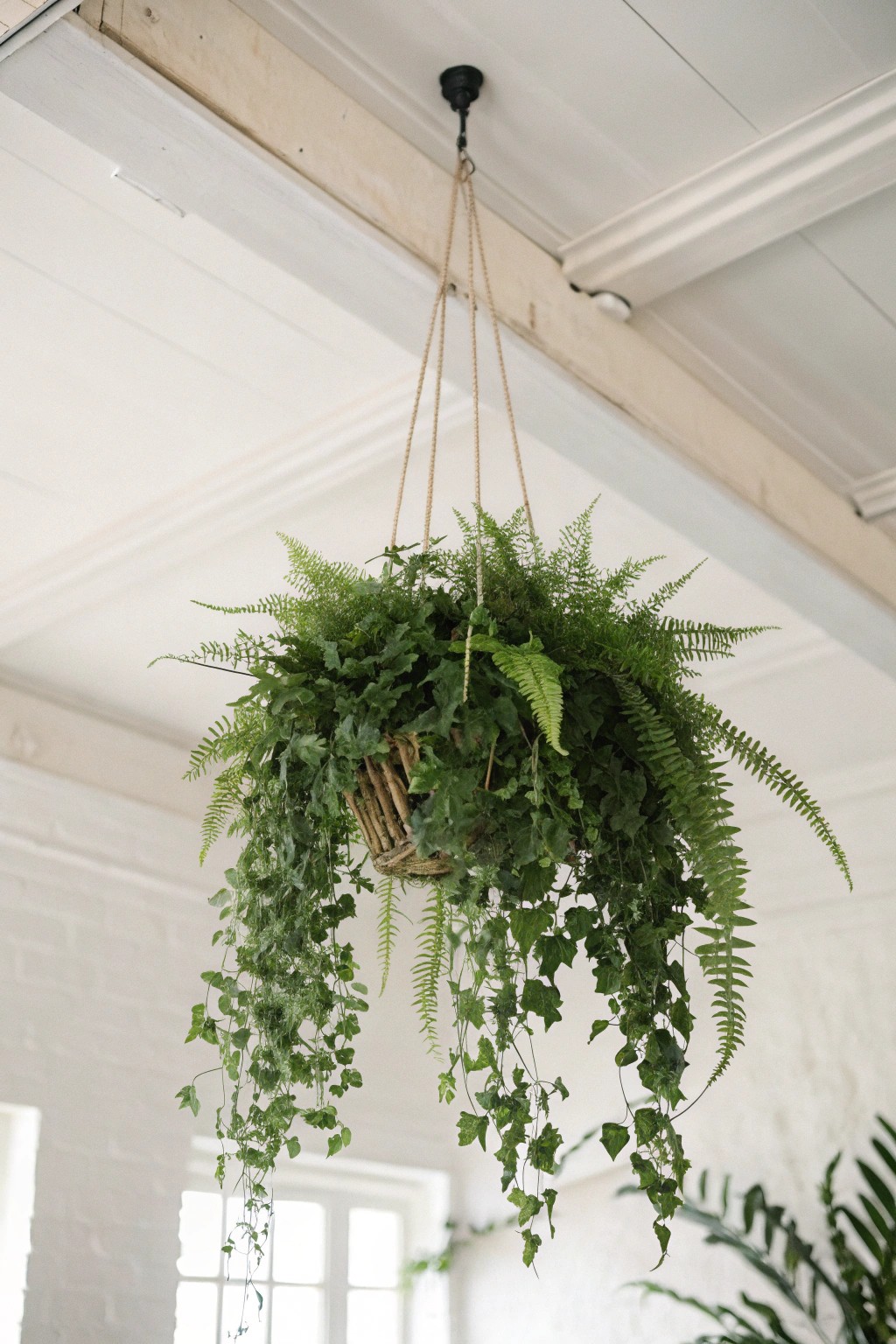 Elevate your space with a handcrafted greenery ceiling centerpiece—nature-inspired simplicity at its finest.