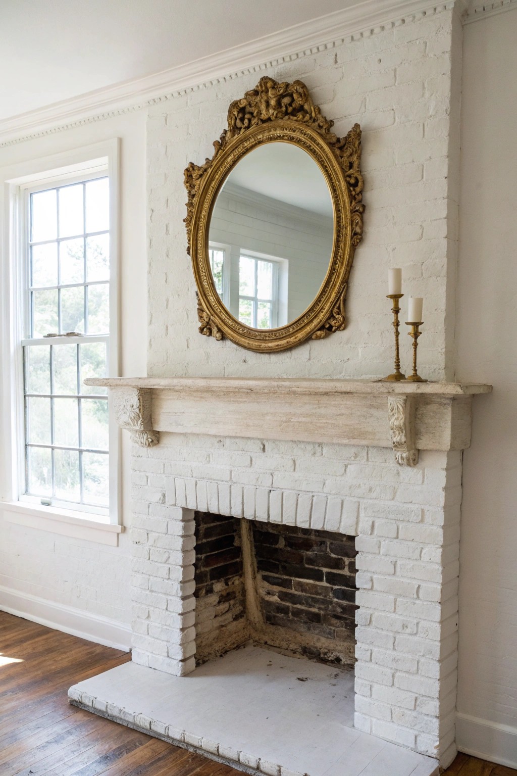Timeless elegance: a vintage mirror brings finesse to a painted brick fireplace.