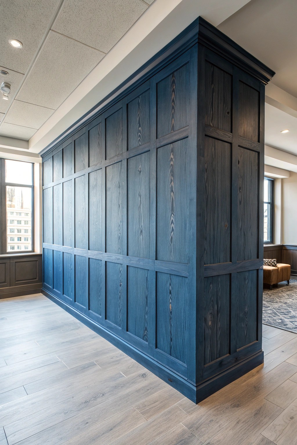 Moody blue paneling: the ultimate statement wall for a refined men's office.