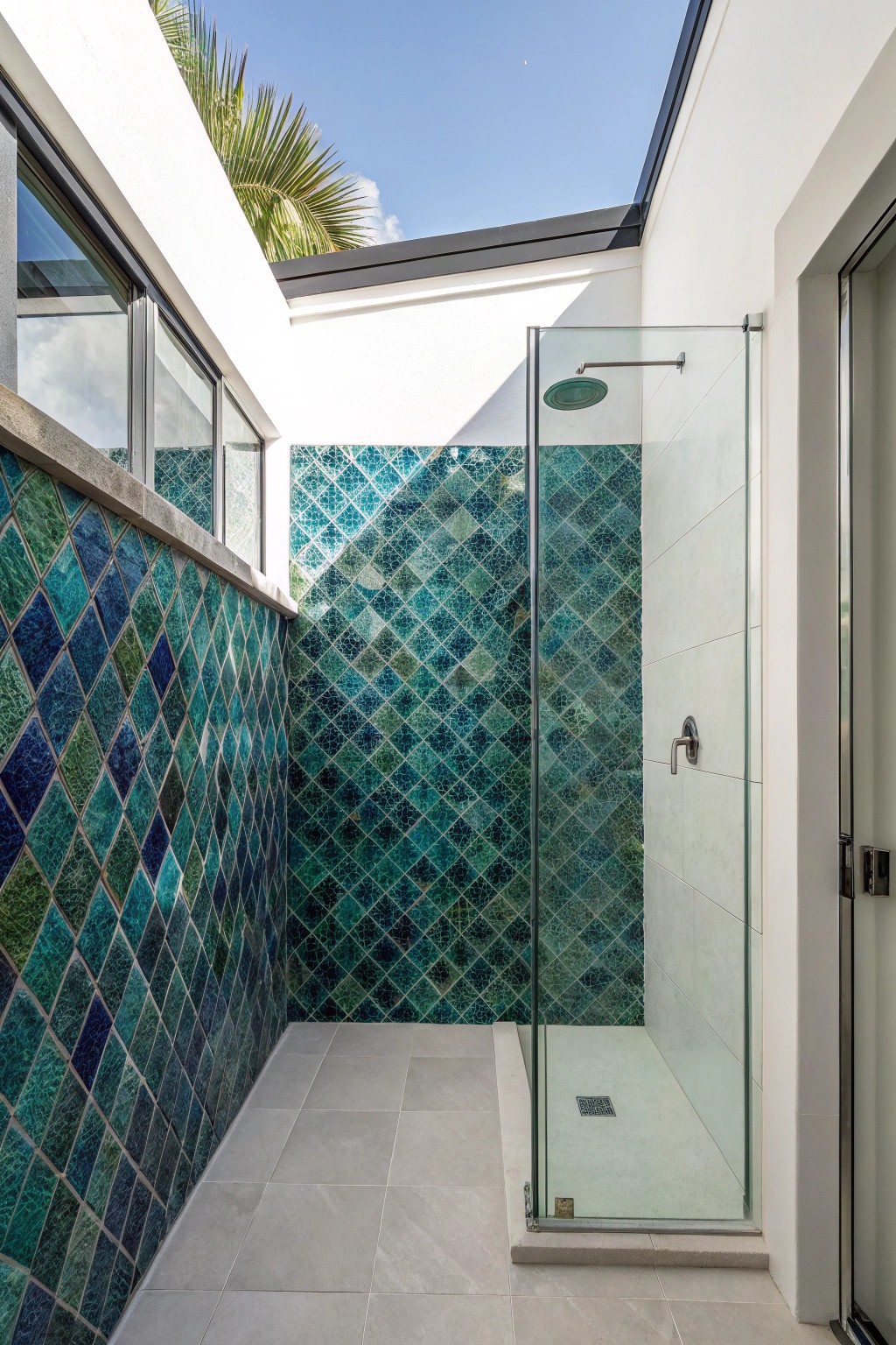 Transform your small bathroom with a stunning mosaic accent wall—where artistry meets simplicity.