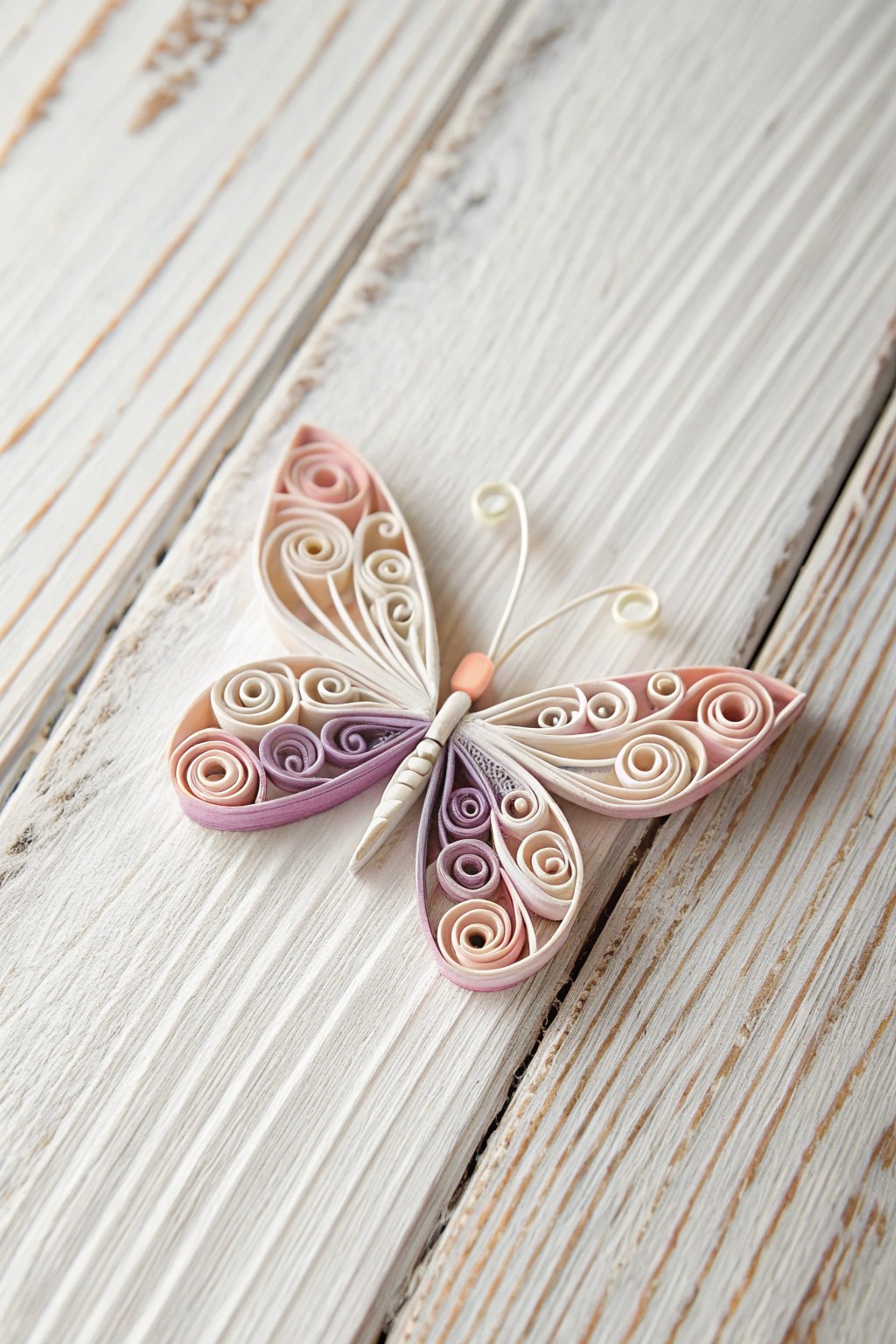 A delicate quilled butterfly brings whimsical charm and handcrafted beauty to Scandinavian-inspired spaces.