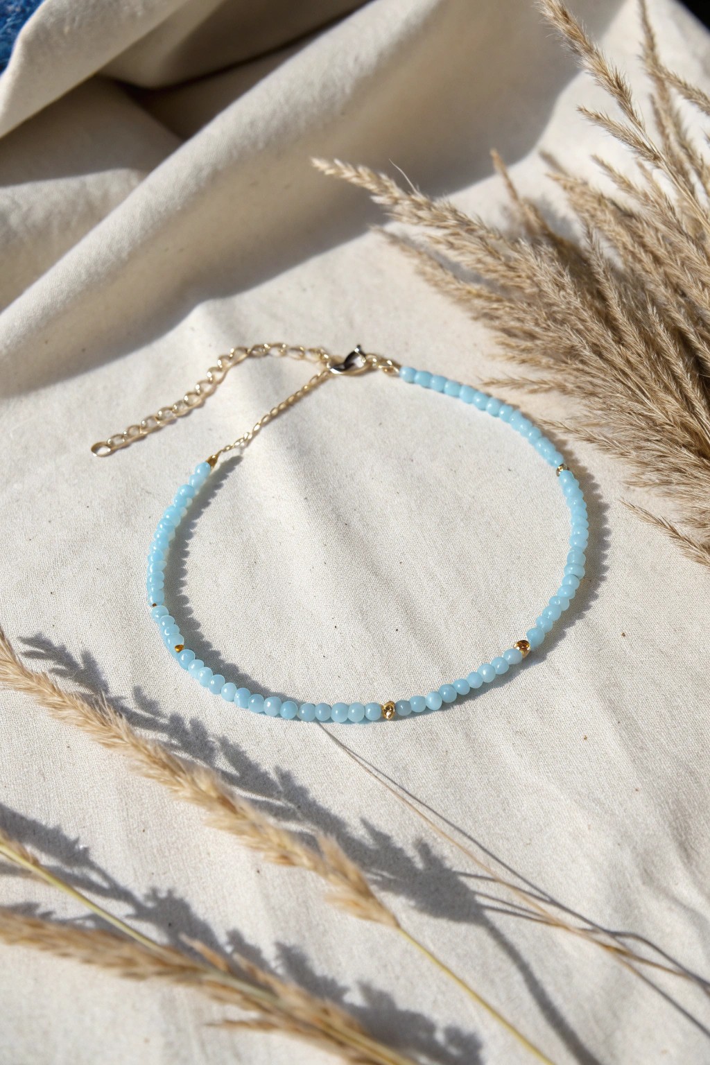 Effortless elegance: a minimalist sky blue bead bracelet that goes with everything.